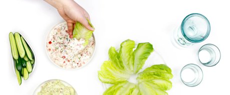 Flat lay shot of cos lettuce leaves on a plate, used for dip